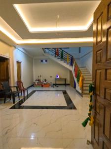 a living room with a staircase and a rug at Taleries Stays in Dirang Dzong +22 photos