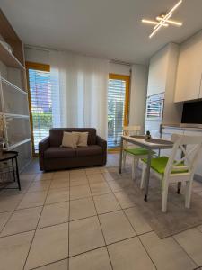 a living room with a couch and a table at NiceStay in Lugano