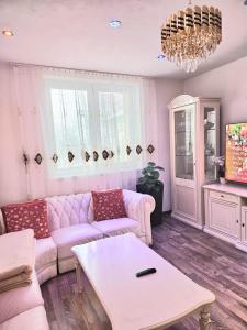 a living room with a couch and a table at Vila Vannet II in Liptovský Mikuláš