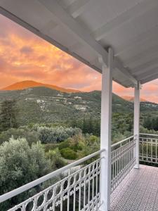a porch with a view of the mountains at Villa Magiko in Poros