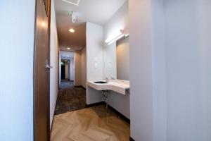 a bathroom with a sink and a mirror at Edo stay senju in Tokyo +75 photos