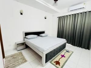 a bedroom with a large bed in a room at Traditional villa in Gurgaon