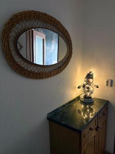 a mirror on top of a dresser in a room at Penzion Borováček in Borová Lada