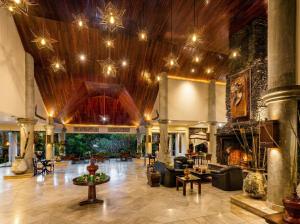 a lobby of a resort with couches and a fireplace at Katiliya Mountain Resort And Spa in Mae Salong Nai