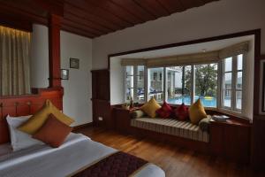 Postelja oz. postelje v sobi nastanitve SpiceTree Munnar