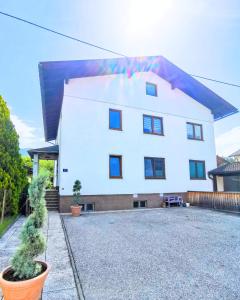 a white house with a painting on the side of it at Riverside Appartements in Lieserbrücke