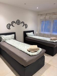 two beds sitting next to each other in a room at Ferienhaus Weitblick Sankt Wendel in Sankt Wendel