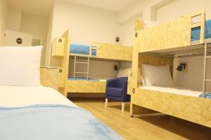 Postel nebo postele na pokoji v ubytování HI!GO