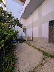 an empty building with a bench in front of it at Dietro l'Angolo in Millesimo