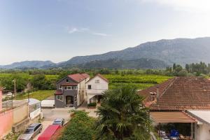 an aerial view of a town with mountains in the background at Holiday Home Vele with pool in Vrgorac