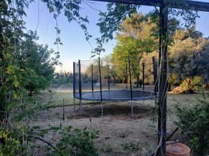 an empty trampoline in a park at Spacious Garden Villa, private pool, huge grounds with orange trees in Dos Hermanas