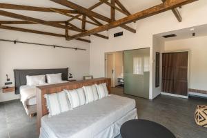a bedroom with a bed and a couch at Hotel Angels in Mythimna +10 photos