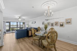 a dining room and living room with a table and chairs at Bouchelle Island 102 in New Smyrna Beach +83 photos