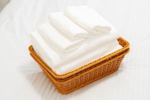 a basket filled with white towels on a white background at Laguna Verde Misono 103 in Sapporo +29 photos