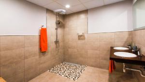 a bathroom with two sinks and a shower at LES FEIXES LLARGUES - max 18 pax in Bolvir +69 photos