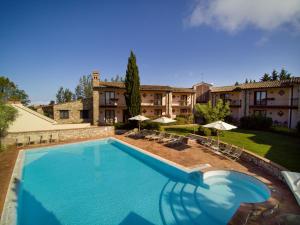 The swimming pool at or close to Relais Il Canalicchio Country Resort & SPA