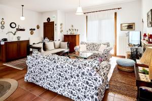 a living room with two couches and a table at Zeusplace Lemon Villa in Korinos