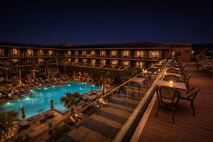 a hotel with a swimming pool at night at Taghazout Palm Hotel in Taghazout +69 photos