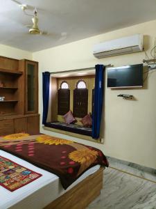 a bedroom with a large mirror on the wall at Third eye view hotel and hostel in Jaisalmer