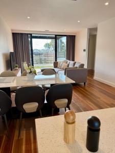 a large living room with a table and chairs at Williamstown Village 2 in Williamstown