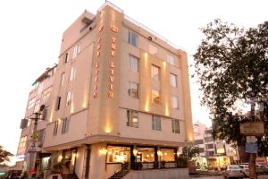 a tall building with lights on the side of it at The Livin-Bani Park in Jaipur