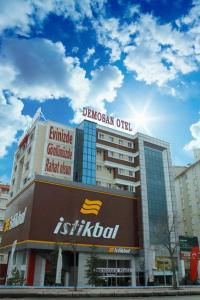 un edificio con un cartel encima en Demosan City Hotel, en Konya