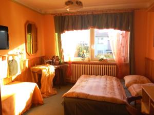 a hotel room with two beds and a window at Ubytování Irena in Benešov