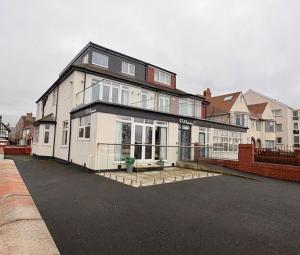 a large white house with a lot of windows at Stay in Blackpool
