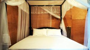 Letto o letti in una camera di Sigiriya River Side Villa