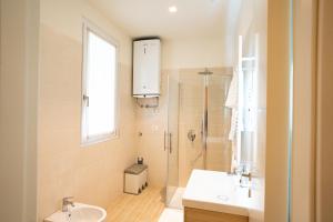 a bathroom with a sink and a toilet and a shower at Locanda dell Angelo in Piacenza +18 photos