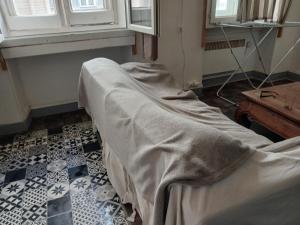 a hospital room with a bed with a blanket at Massilia in Marseille