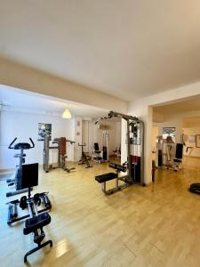 a gym with cardio equipment in a large room at Polis Gardens Pool Apartment in Polis Chrysochous