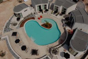 an overhead view of a swimming pool at a resort at Kyklio Pavilions in Nafplio +91 photos