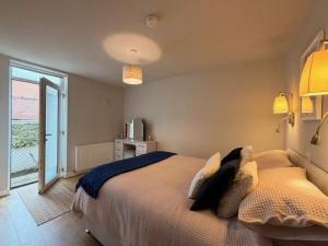 a bedroom with a large bed and a window at Stay in Blackpool