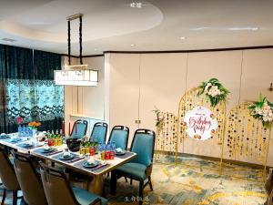 a conference room with a long table and chairs at Royal House Hotel in Ulaanbaatar