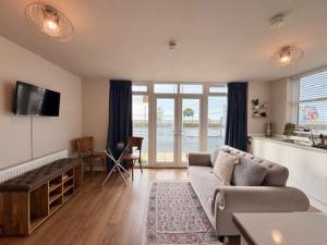 a living room with a couch and a table at Stay in Blackpool