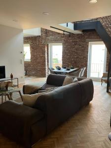 a living room with a couch and a table at freiheitACHT in Raesfeld