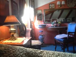 a bedroom with a bed and a table with a lamp at Studios Kono in Kotor +37 photos