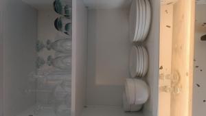 a closet with plates and bowls on the wall at NEW BOSTON in Bellville
