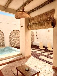 a room with a jacuzzi tub in a building at Suite ideal para escapadas romanticas in Bullas