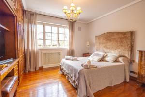 a bedroom with a bed and a large window at Villa familiar - Jacuzzi - Children's Area in Bacoy +59 photos