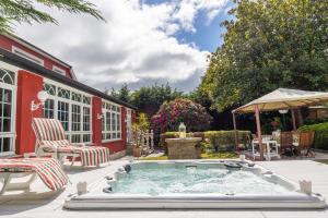 a hot tub in the backyard of a house at Villa familiar - Jacuzzi - Children's Area in Bacoy