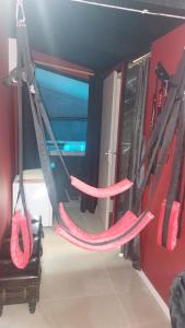 a couple of hammocks hanging in a room at Love room les pins in Le Muy