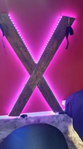 a room with pink lights on the ceiling at Love room les pins in Le Muy +1 photo