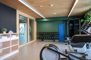a room with a gym with a bike in it at AVES Hotel Savognin in Savognin