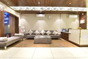 a lobby with couches and a couch in a room at Hotel Shaily Royal in Kota
