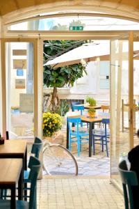 a restaurant with a patio with tables and chairs at Albergo Diffuso Monopoli in Monopoli
