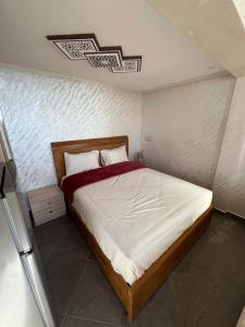 a bedroom with a large bed in a room at private apparemment with ocean view in Taghazout