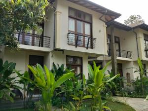 a house with plants in front of it at Green villa in Galle