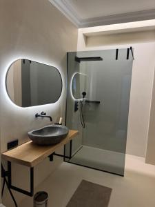 a bathroom with a sink and a shower at Rambynas R36 SELF CHECK-IN in Panevėžys